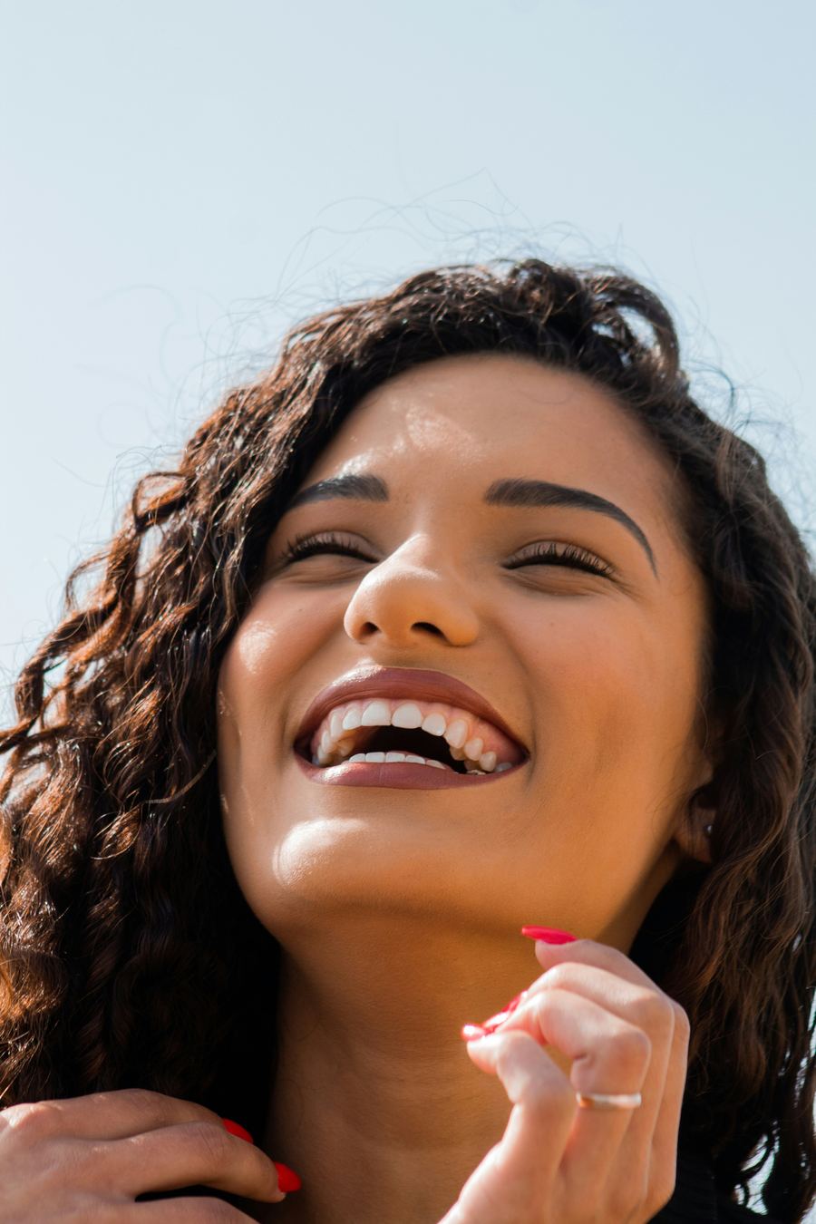 Woman with radiant white smile after professional teeth whitening at Carte Blanche Los Angeles